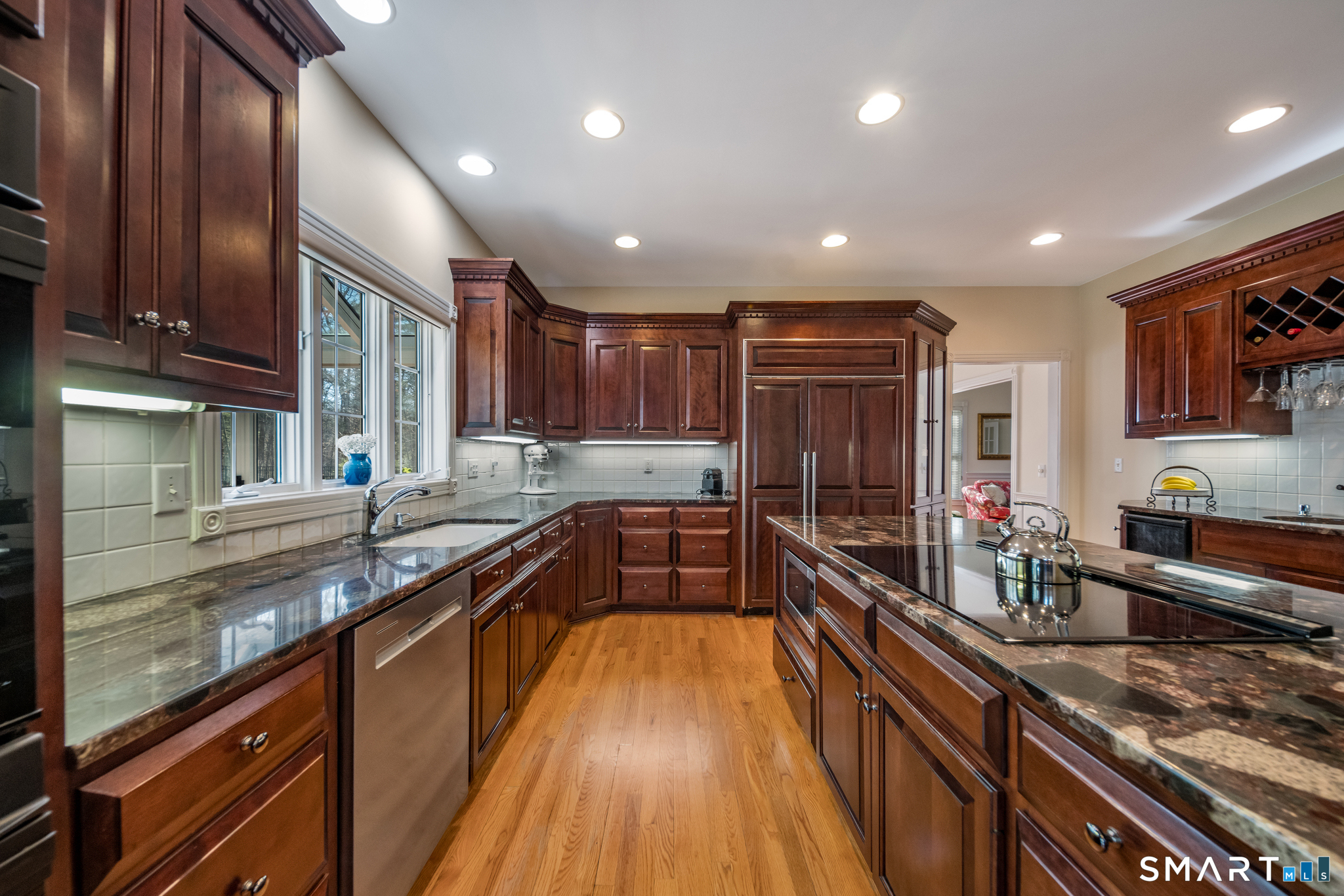 11 Kachina Way Madison, CT 06443 - Photo 15 of 40 a kitchen with granite countertop lots of counter top space and stainless steel appliances