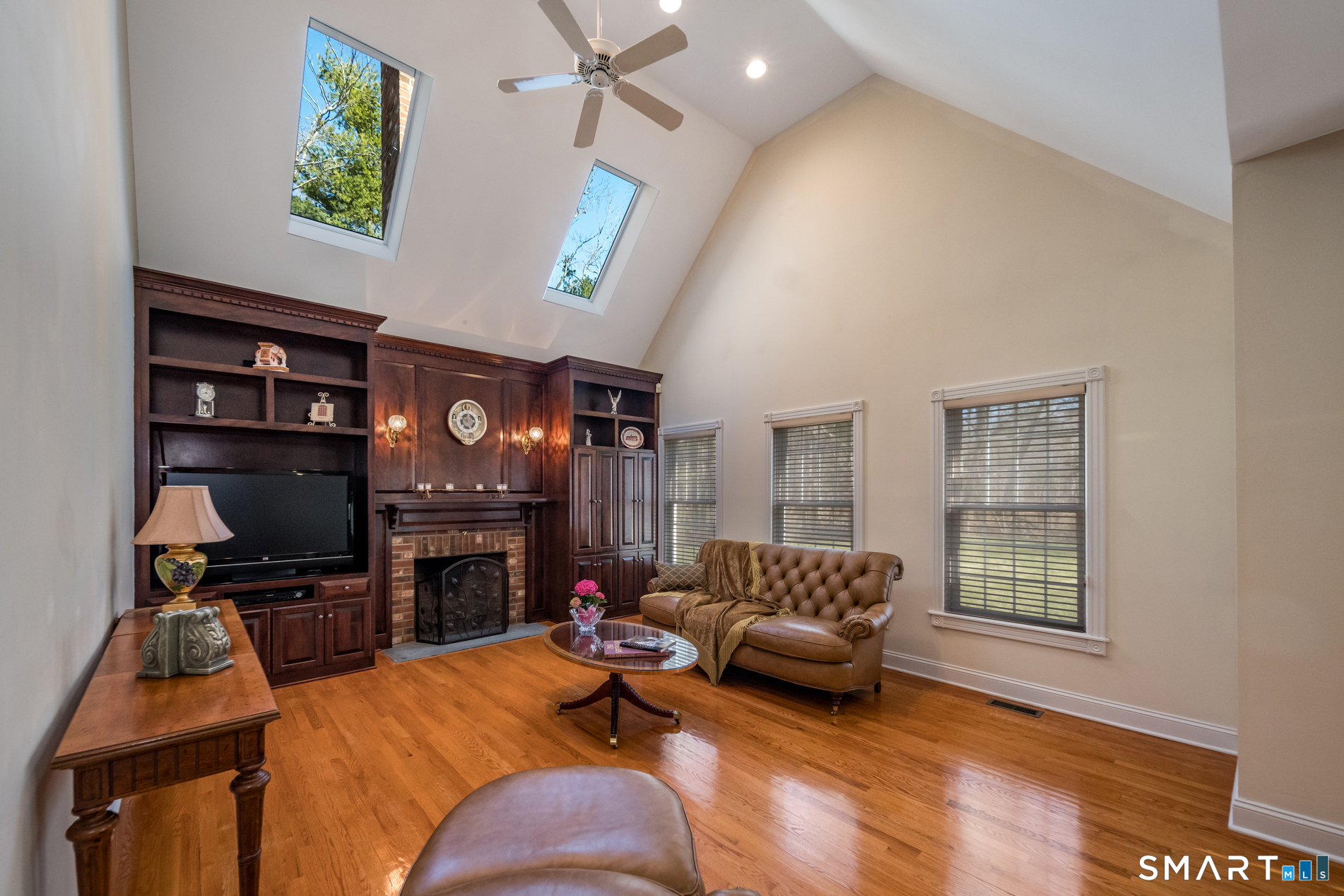 11 Kachina Way Madison, CT 06443 - Photo 17 of 40 a living room with furniture and a flat screen tv