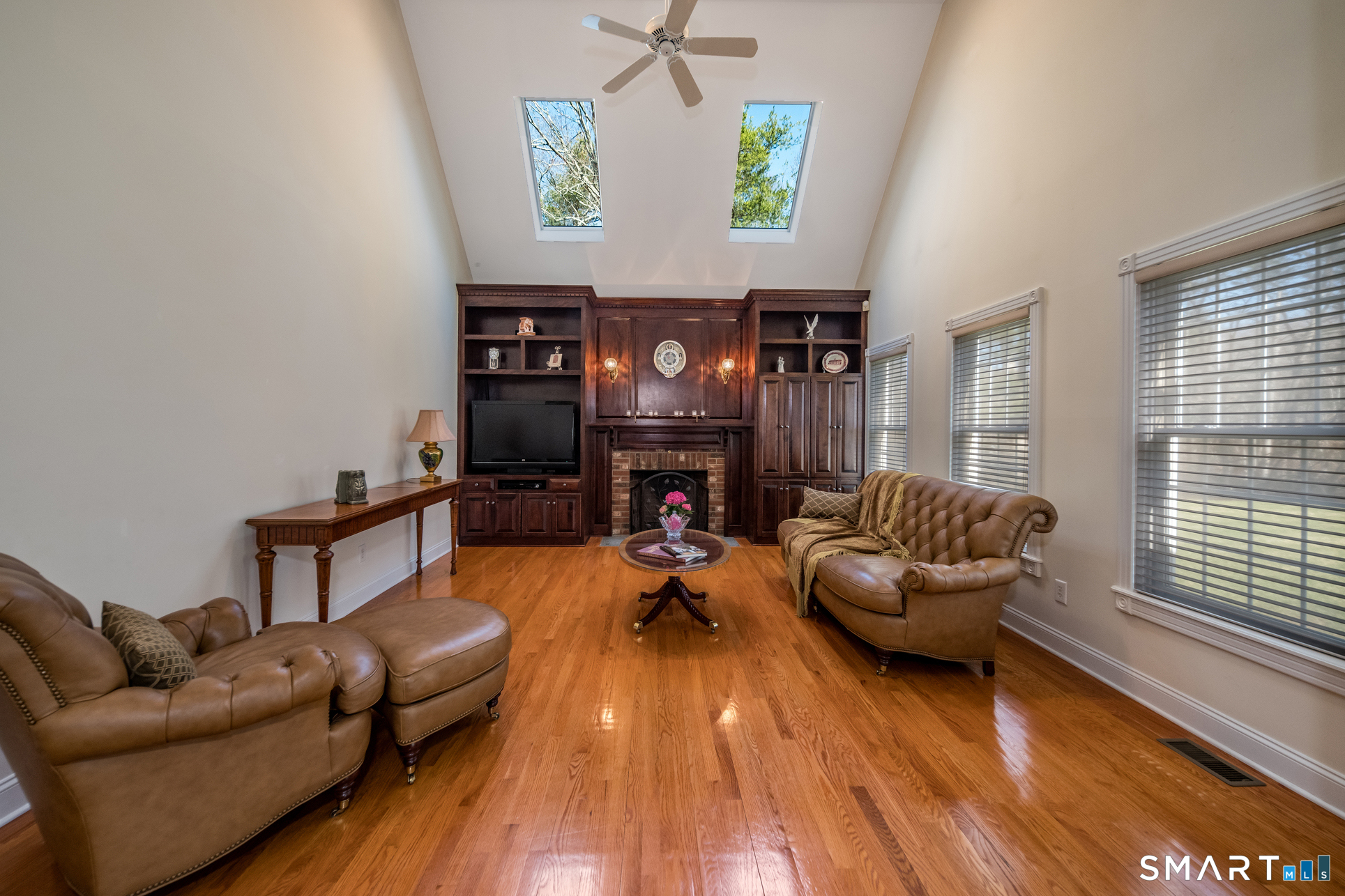 11 Kachina Way Madison, CT 06443 - Photo 18 of 40 a living room with furniture and a fireplace