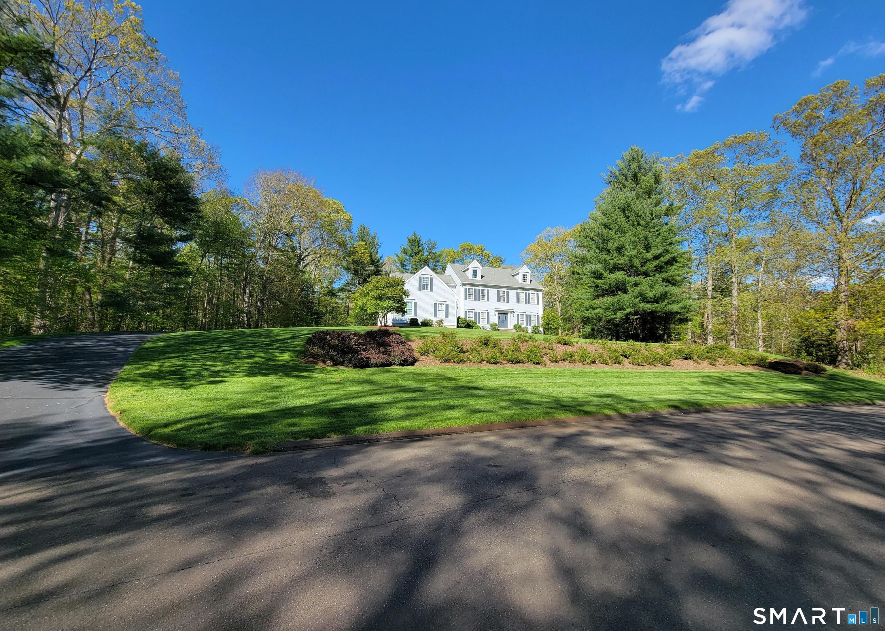 11 Kachina Way Madison, CT 06443 - Photo 2 of 40 a view of a garden with large trees