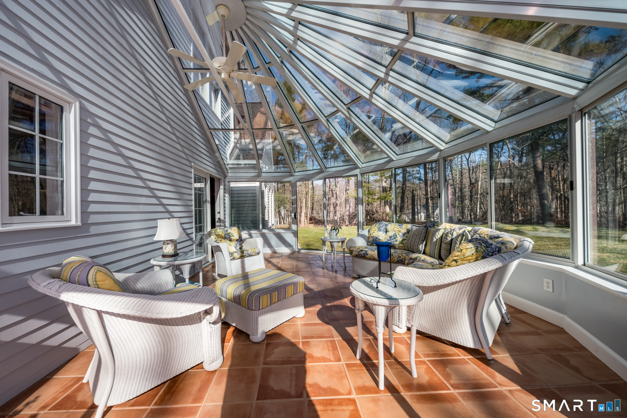 11 Kachina Way Madison, CT 06443 - Photo 21 of 40 a view of a patio with a dining table and chairs