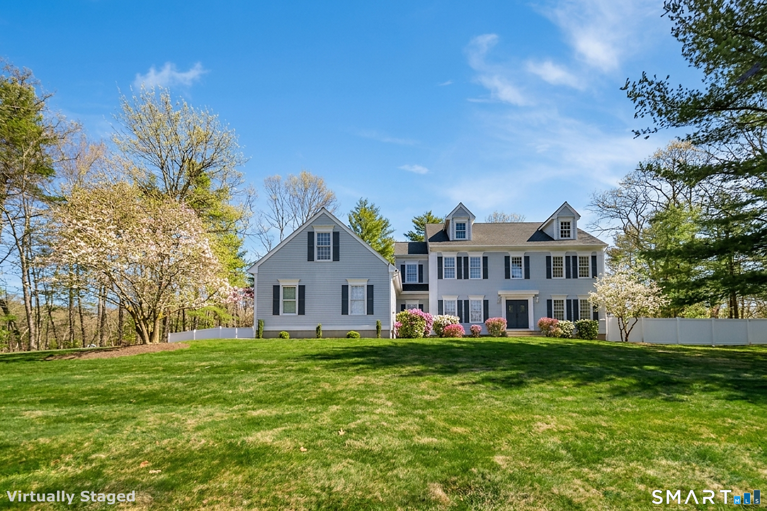 11 Kachina Way Madison, CT 06443 - Photo 3 of 40 a front view of a house with a yard table and chairs