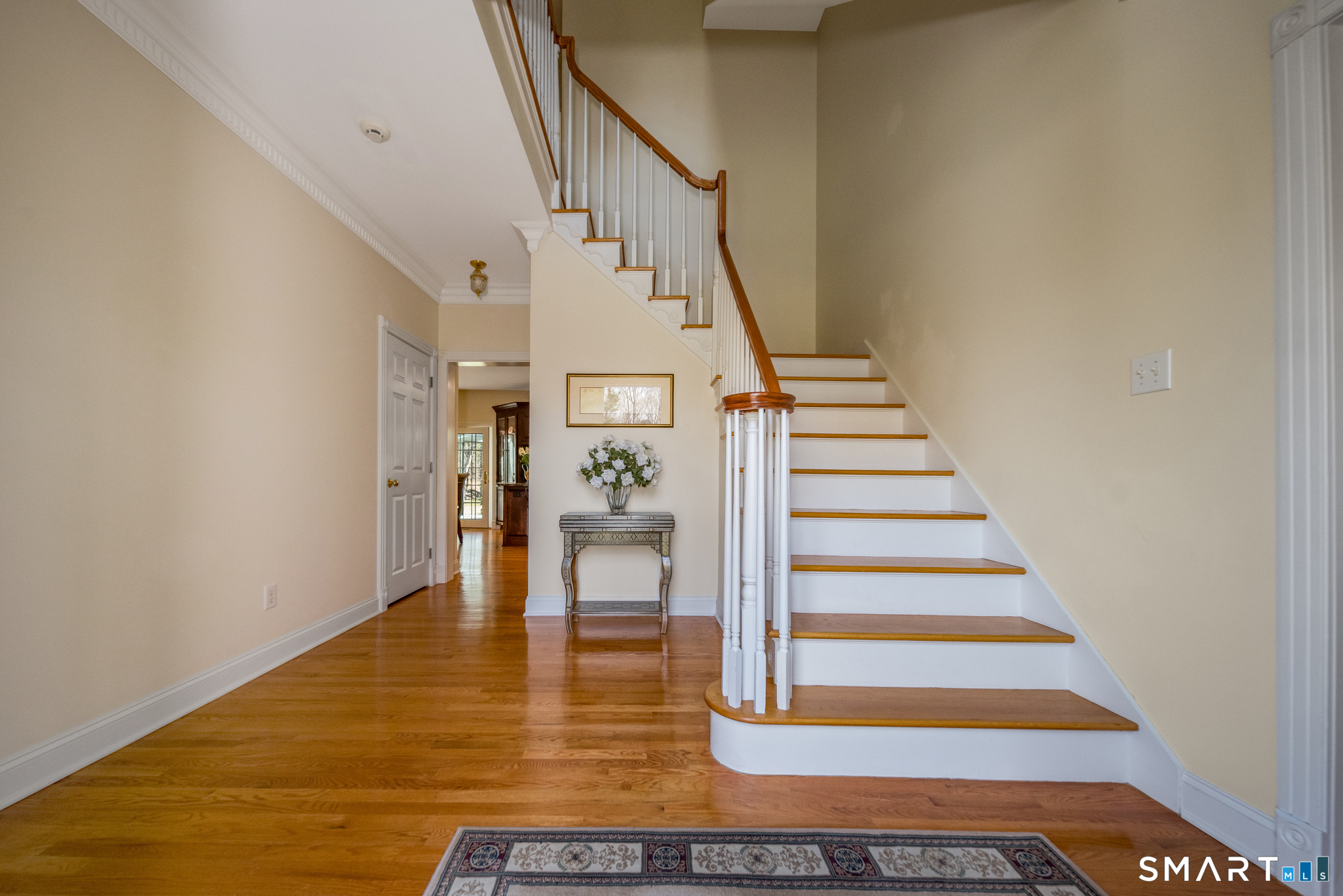 11 Kachina Way Madison, CT 06443 - Photo 5 of 40 a view of entryway and hall with wooden floor