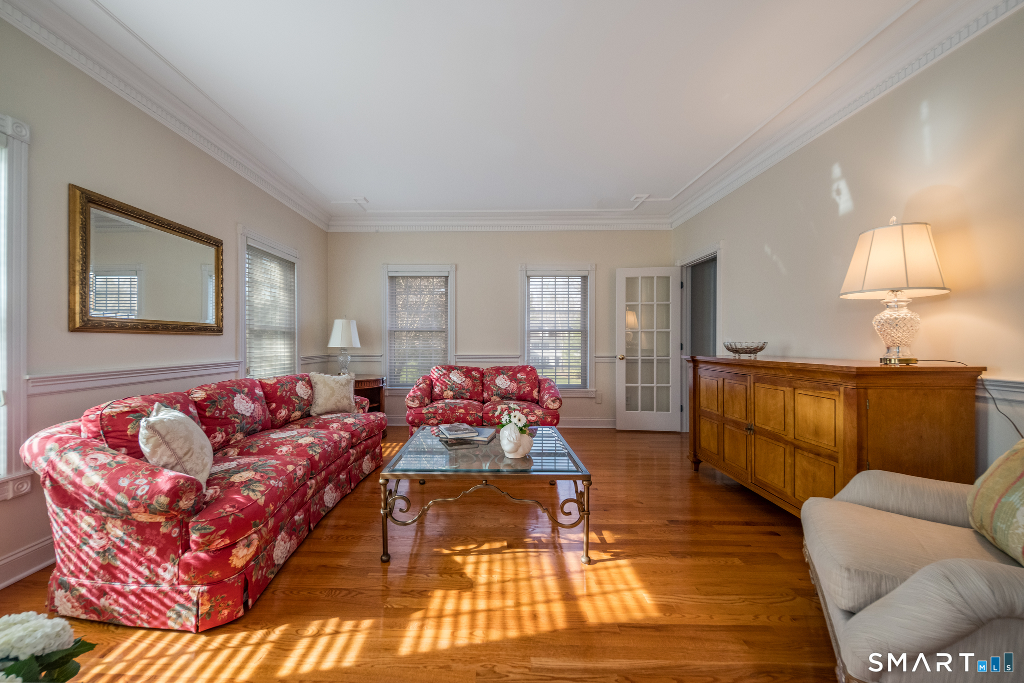 11 Kachina Way Madison, CT 06443 - Photo 6 of 40 a living room with furniture and a lamp