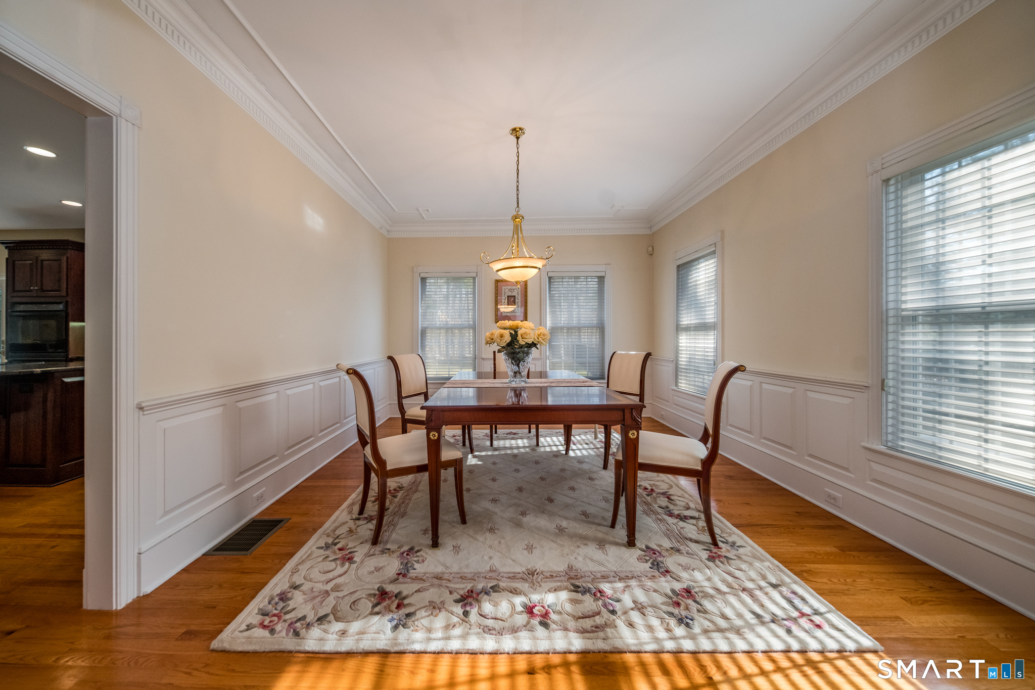11 Kachina Way Madison, CT 06443 - Photo 8 of 40 a dining room with furniture a rug and wooden floor