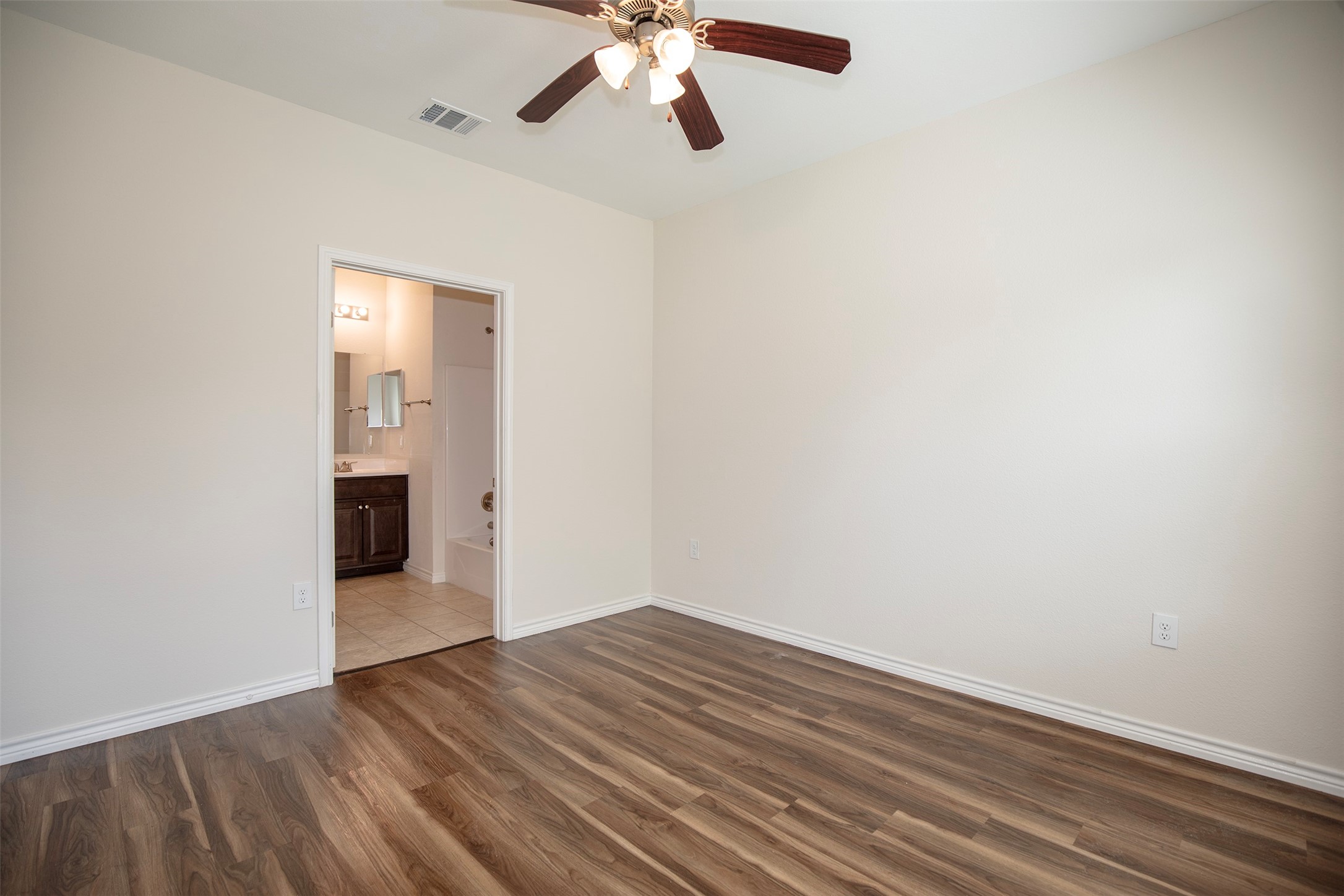1125 Lake Road La Marque, TX 77568 - Photo 15 of 26 Natural light fills the room in the primary suite.