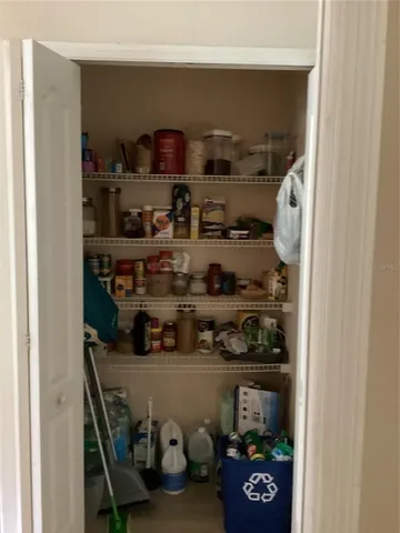 a kitchen with lots of bottles of alcohol