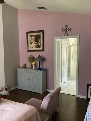 a bedroom with furniture and window