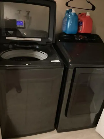 a backyard of a house with a yard and outdoor seating