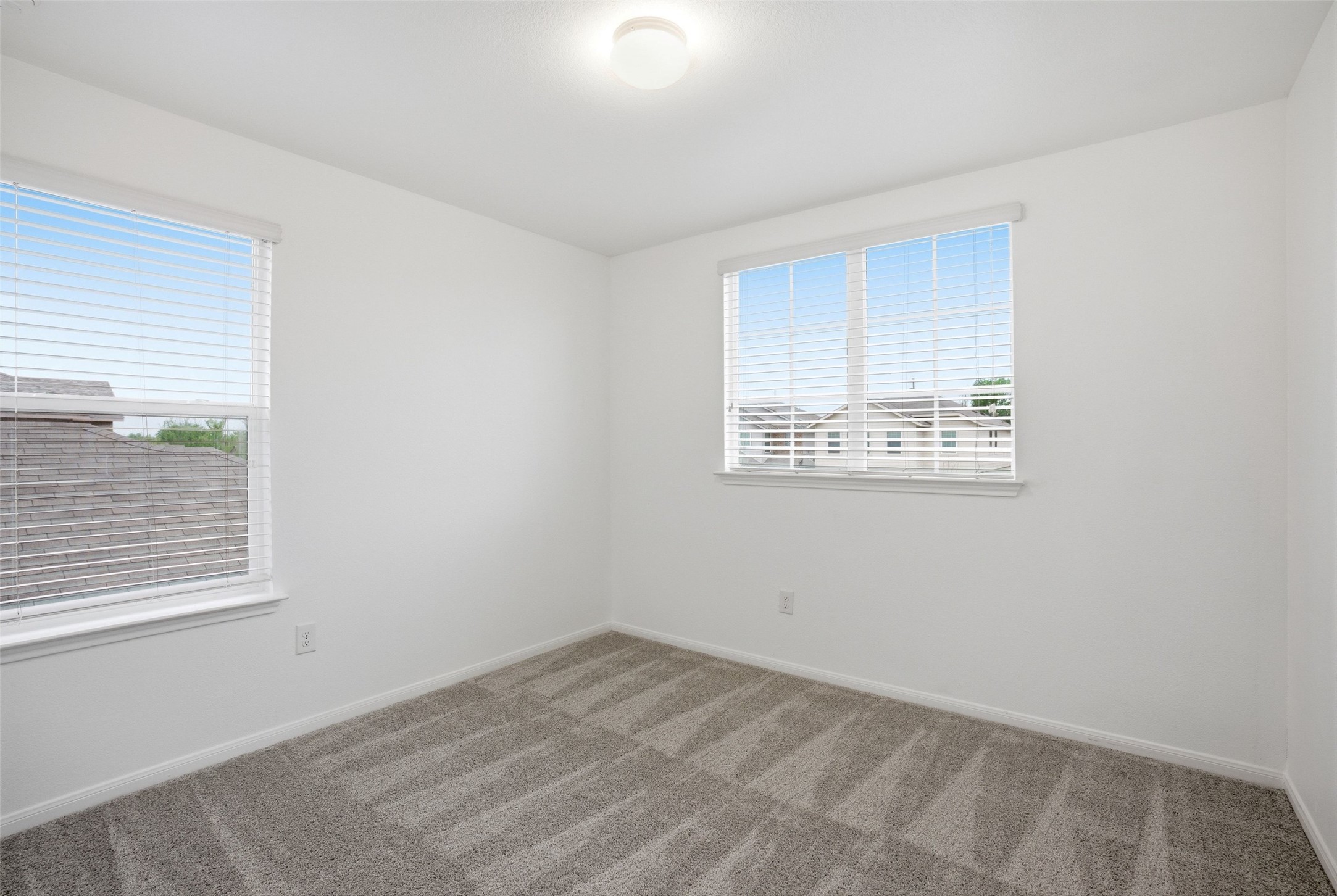 3009 Tilmon Ln. Austin, TX 78725 - Photo 22 of 33 Carpeted spare room featuring baseboards