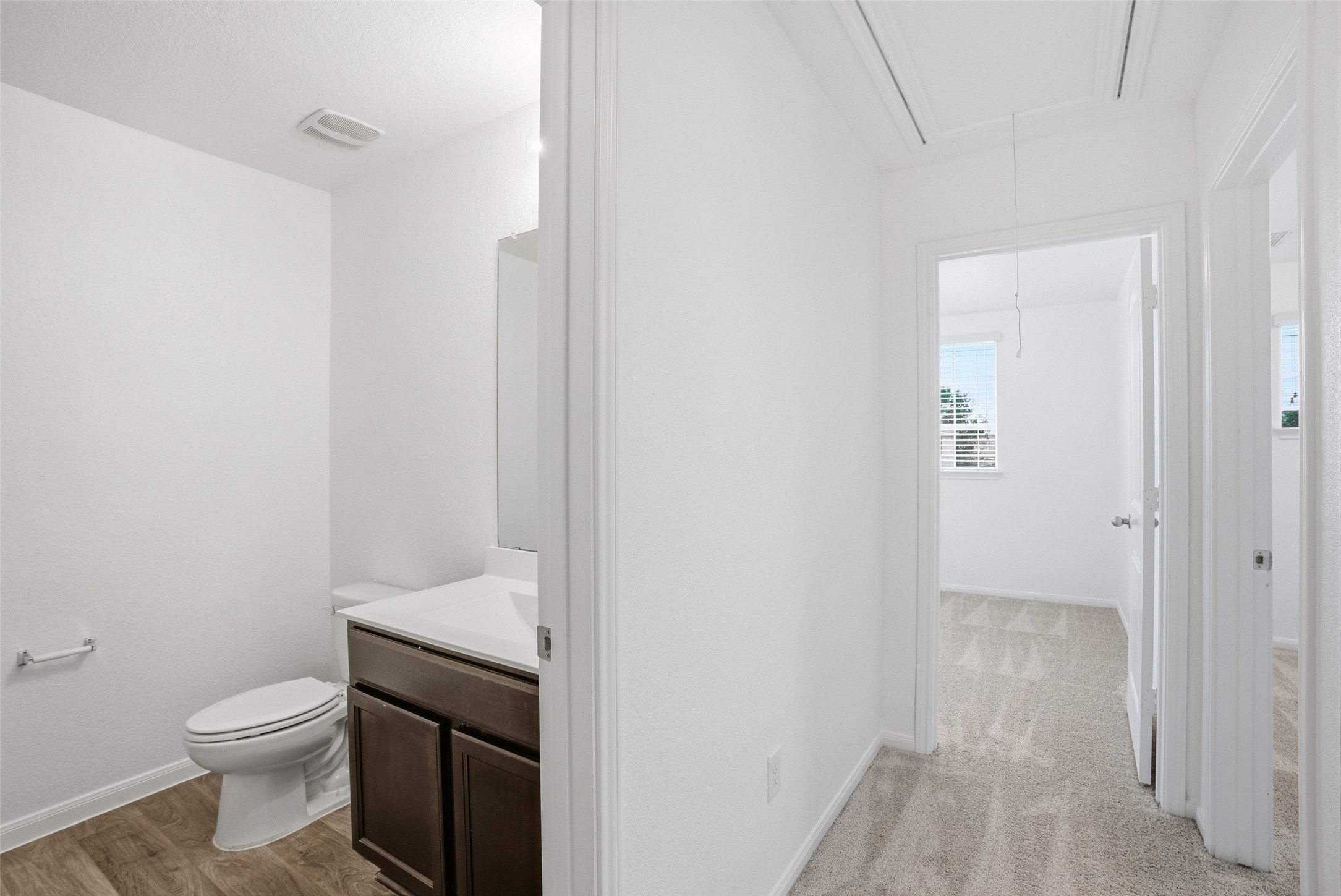 3009 Tilmon Ln. Austin, TX 78725 - Photo 23 of 33 Half bath featuring toilet and vanity
