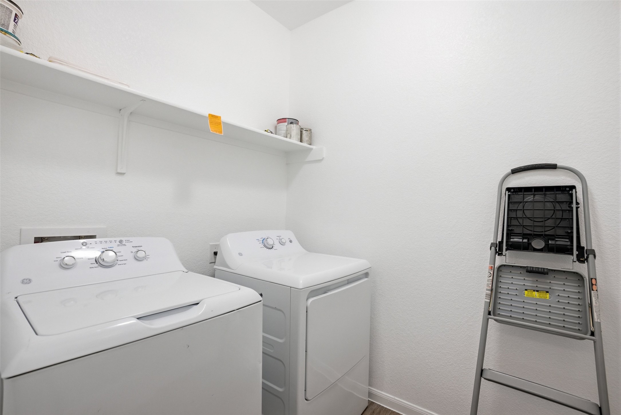 3009 Tilmon Ln. Austin, TX 78725 - Photo 27 of 33 Laundry room with baseboards and washer and clothes dryer
