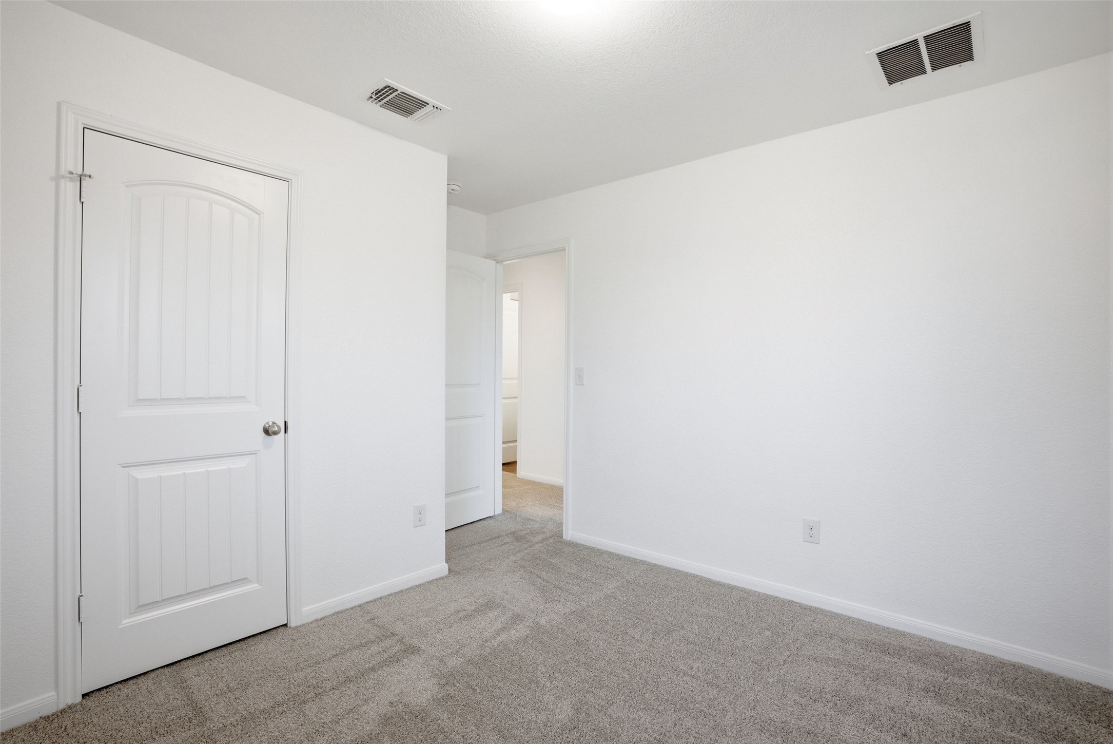 3009 Tilmon Ln. Austin, TX 78725 - Photo 29 of 33 Unfurnished bedroom with light colored carpet and baseboards