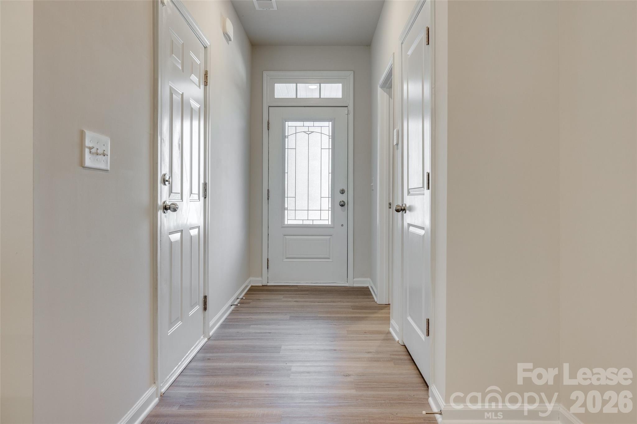 807 Gable Oak Lane Fort Mill, SC 29708 - Photo 3 of 39 a view of a hallway with wooden floor and windows