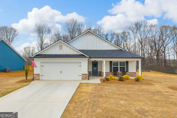 an aerial view of a house with swimming pool