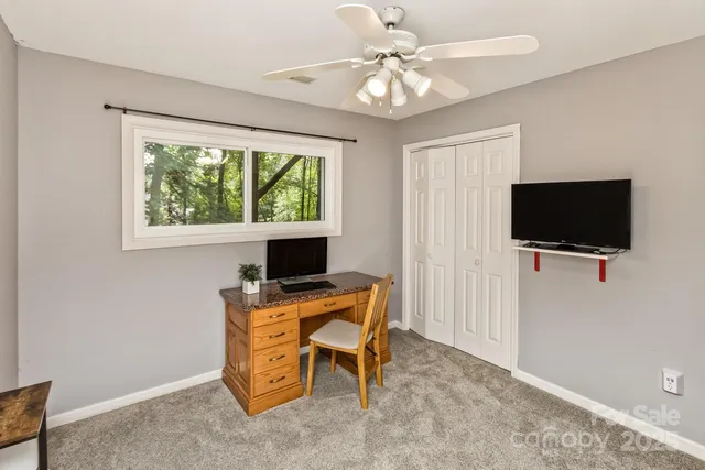 a living room with furniture and flat screen tv