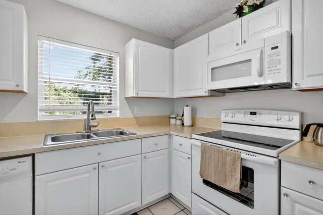a view of a dining room with furniture and window