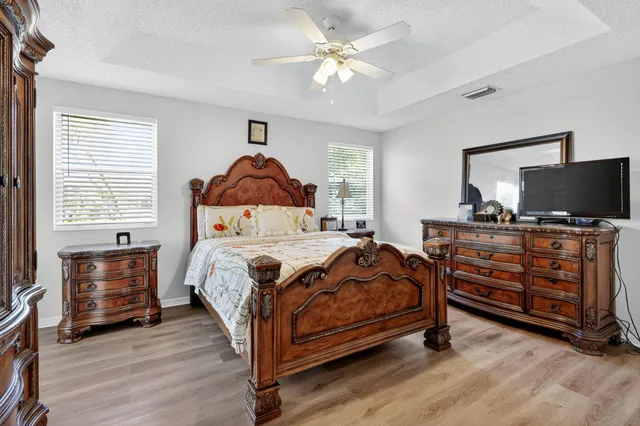 a bathroom with a tub sink and window