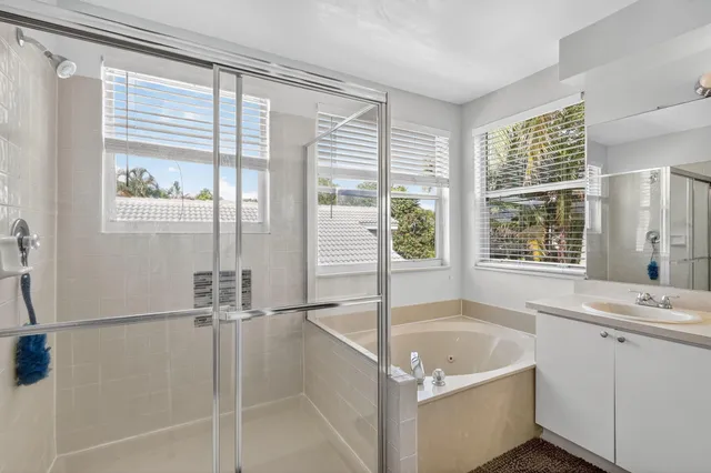a bath tub sitting next to a window