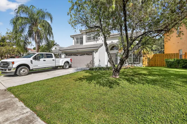 a view of a car in front of a house