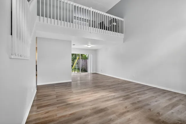 a view of an entryway with wooden floor