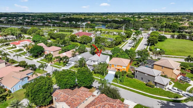 an aerial view of a houses with a lake view