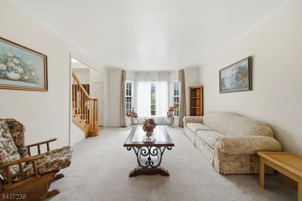 a livingroom with furniture and a window