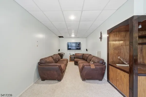 a black and white photo of a living room