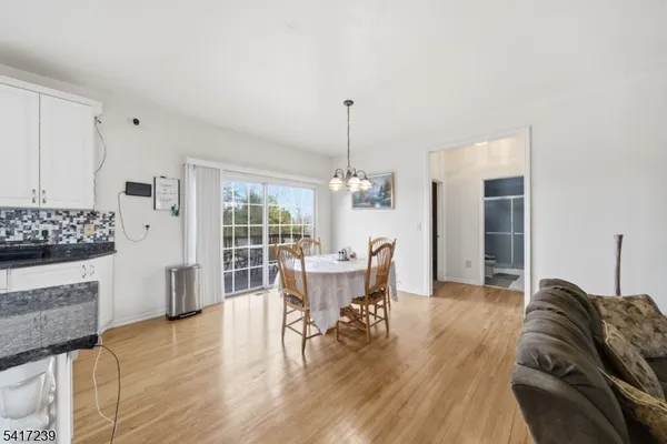 a living room with furniture fireplace and a flat screen tv