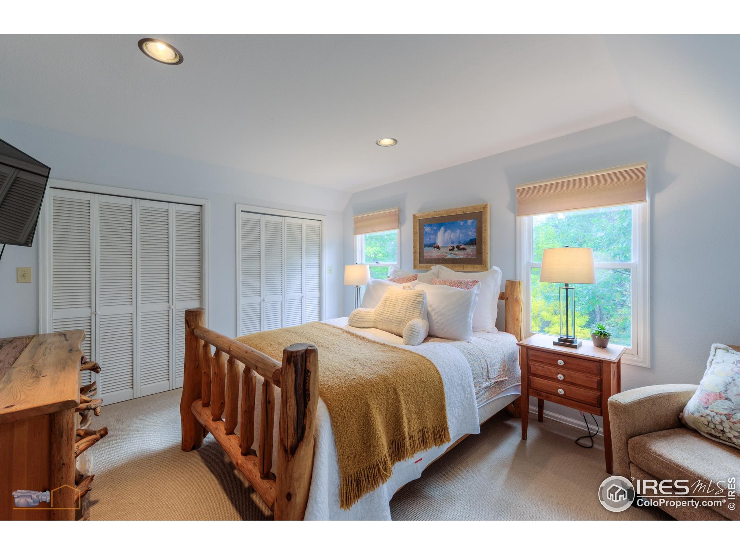3737 26th Street Boulder, CO 80304 - Photo 15 of 47 a bedroom with a bed a couch and a window