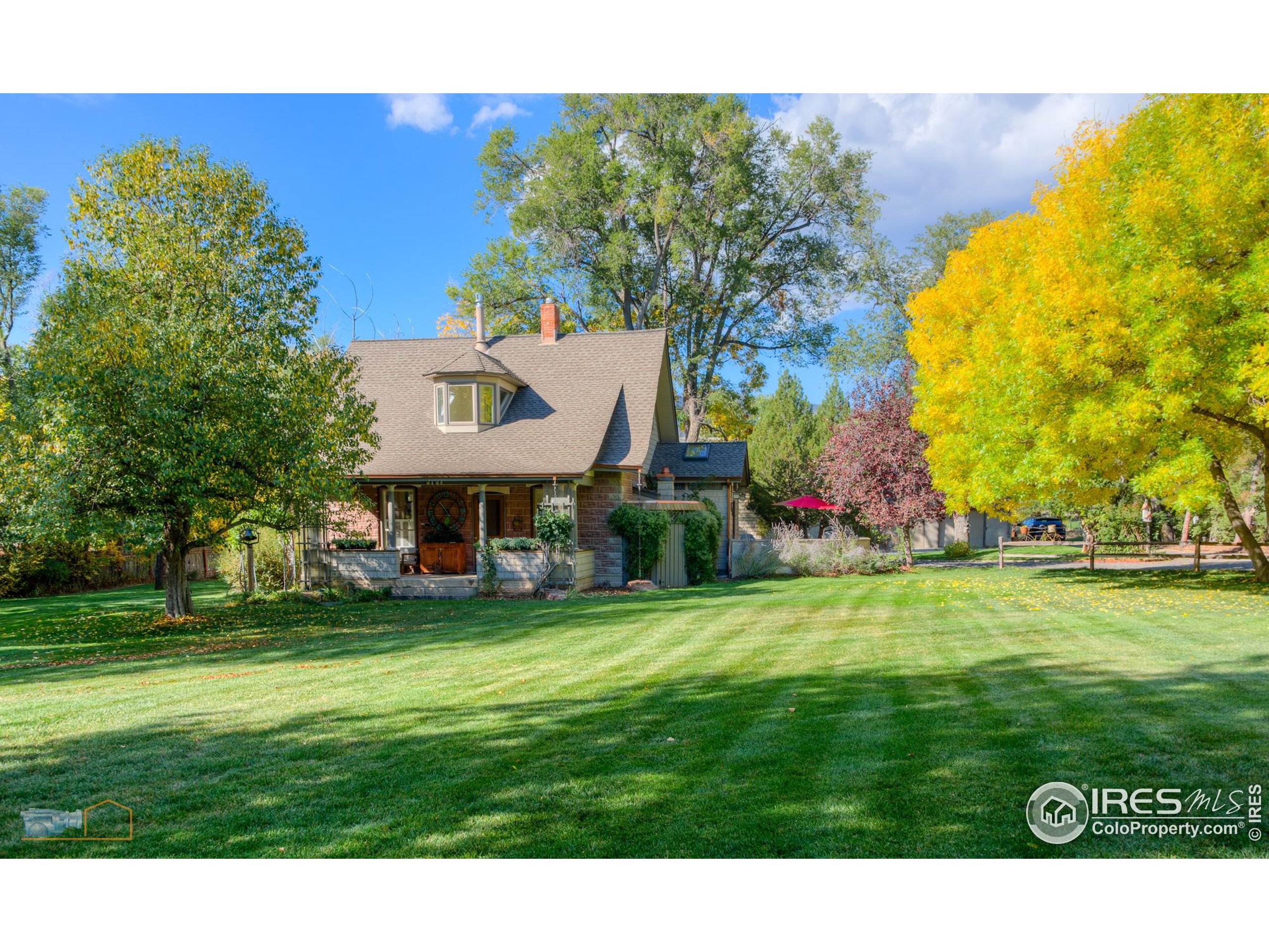 3737 26th Street Boulder, CO 80304 - Photo 41 of 47 a view of a house with a big yard and large trees
