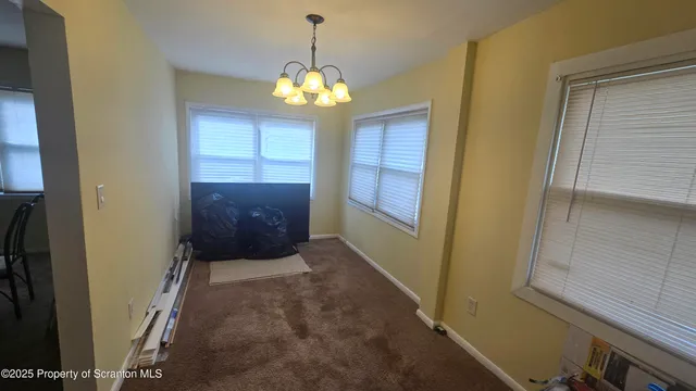 a view of a chandelier and window in the house