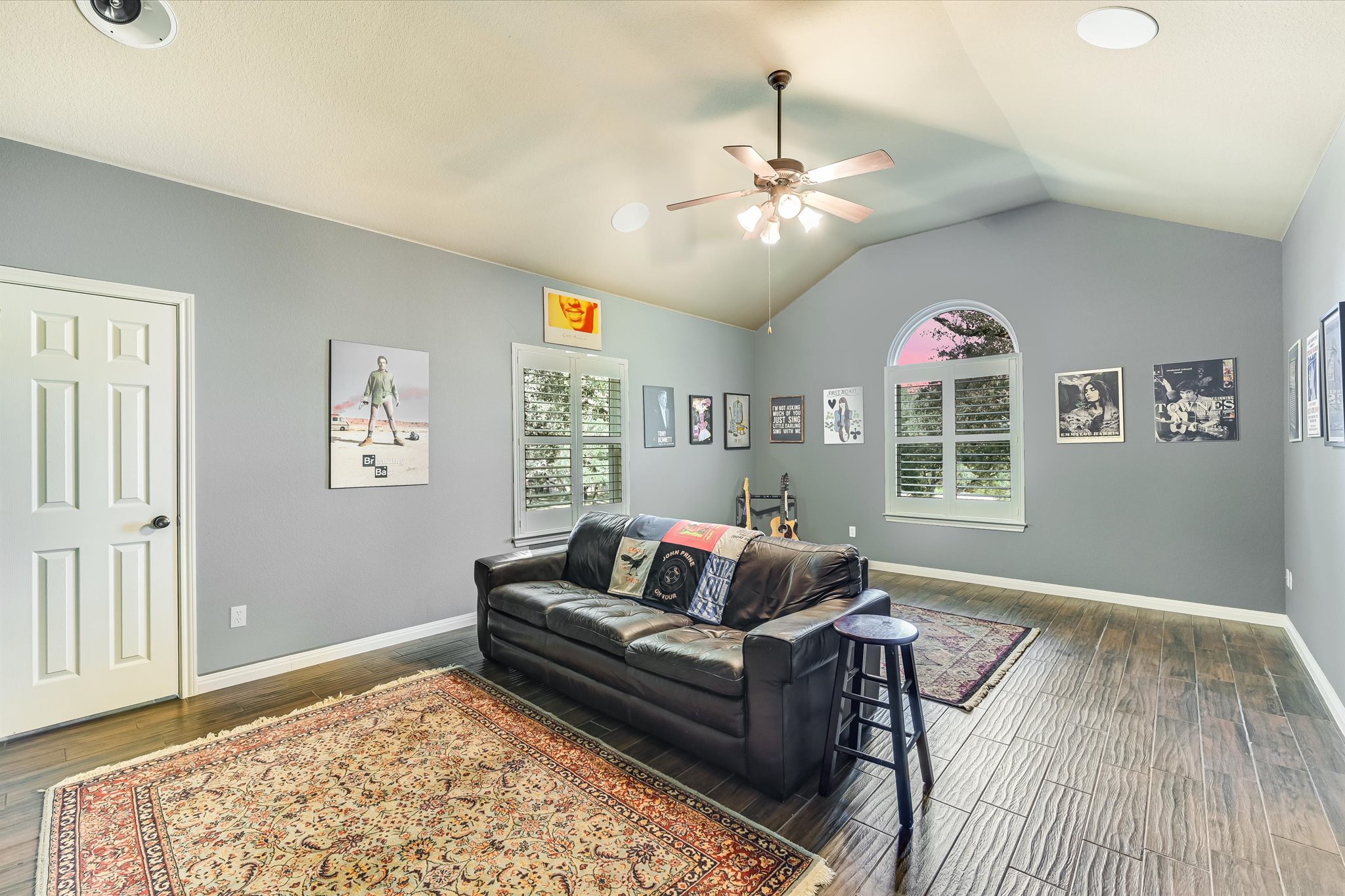 786 Ranchers Club Lane Driftwood, TX 78619 - Photo 13 of 33 Living room featuring vaulted ceiling, plenty of natural light, wood finished floors, and ceiling fan