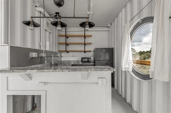 a kitchen with a stove and a sink