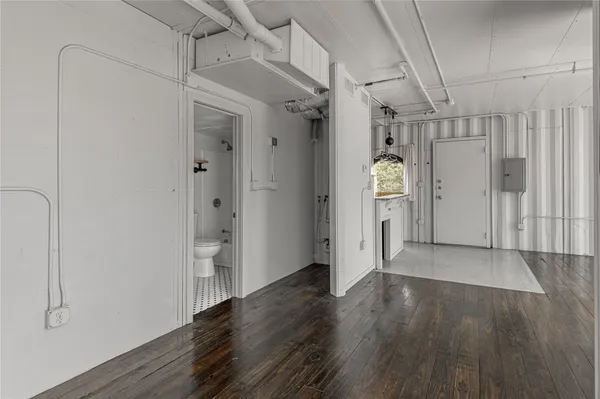a white toilet sitting next to a bathroom sink