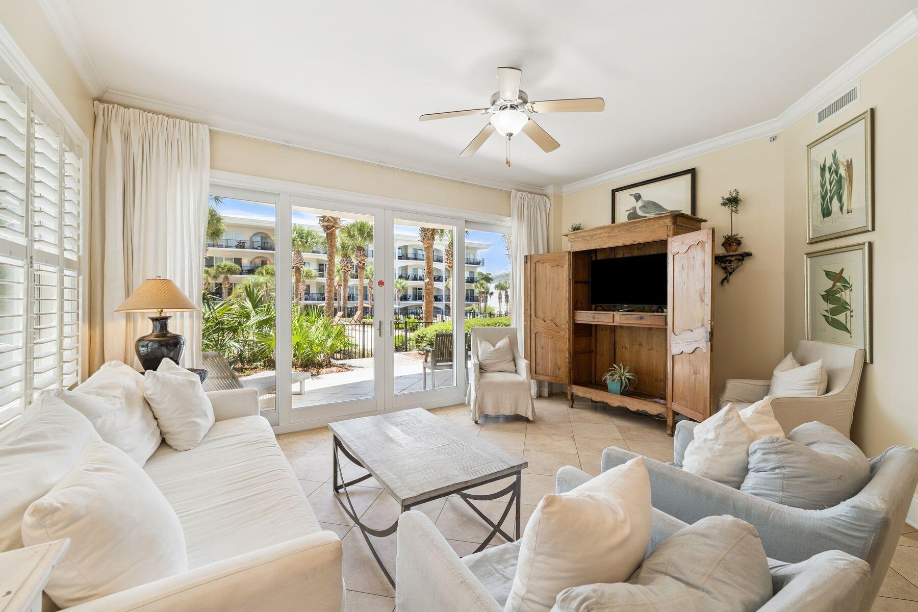 2421 West County Highway 30A, Unit D101 Santa Rosa Beach, FL 32459 - Photo 11 of 44 a living room with furniture and a flat screen tv