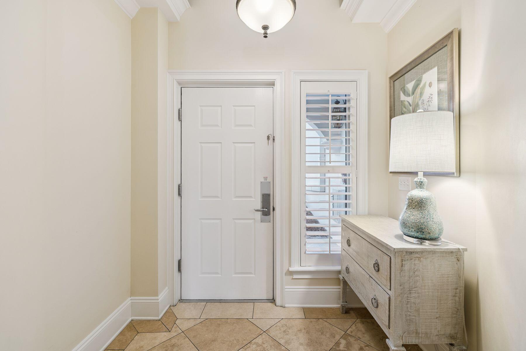 2421 West County Highway 30A, Unit D101 Santa Rosa Beach, FL 32459 - Photo 14 of 44 a room with a window and a potted plant