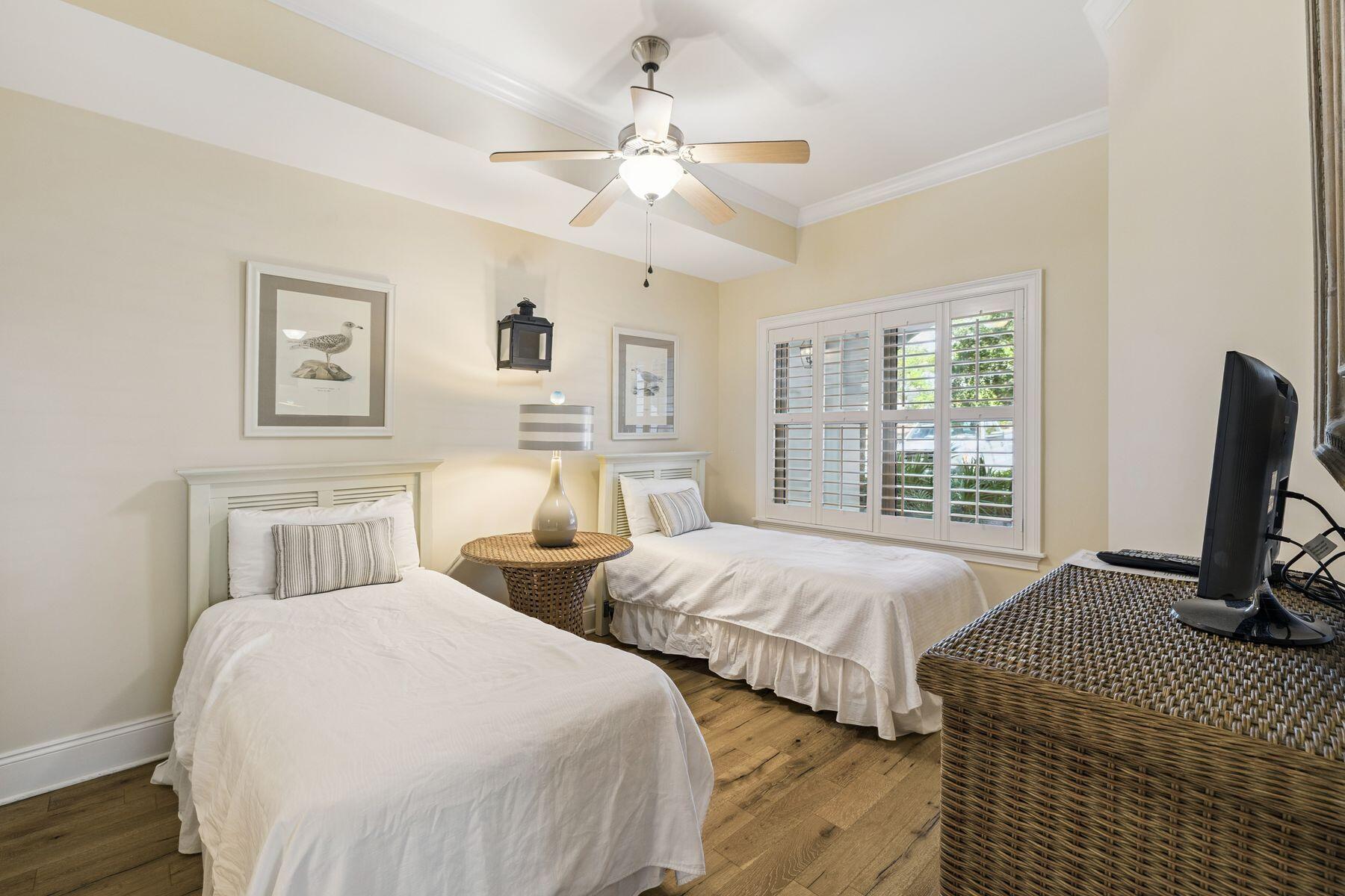 2421 West County Highway 30A, Unit D101 Santa Rosa Beach, FL 32459 - Photo 15 of 44 a bedroom with two beds and a window