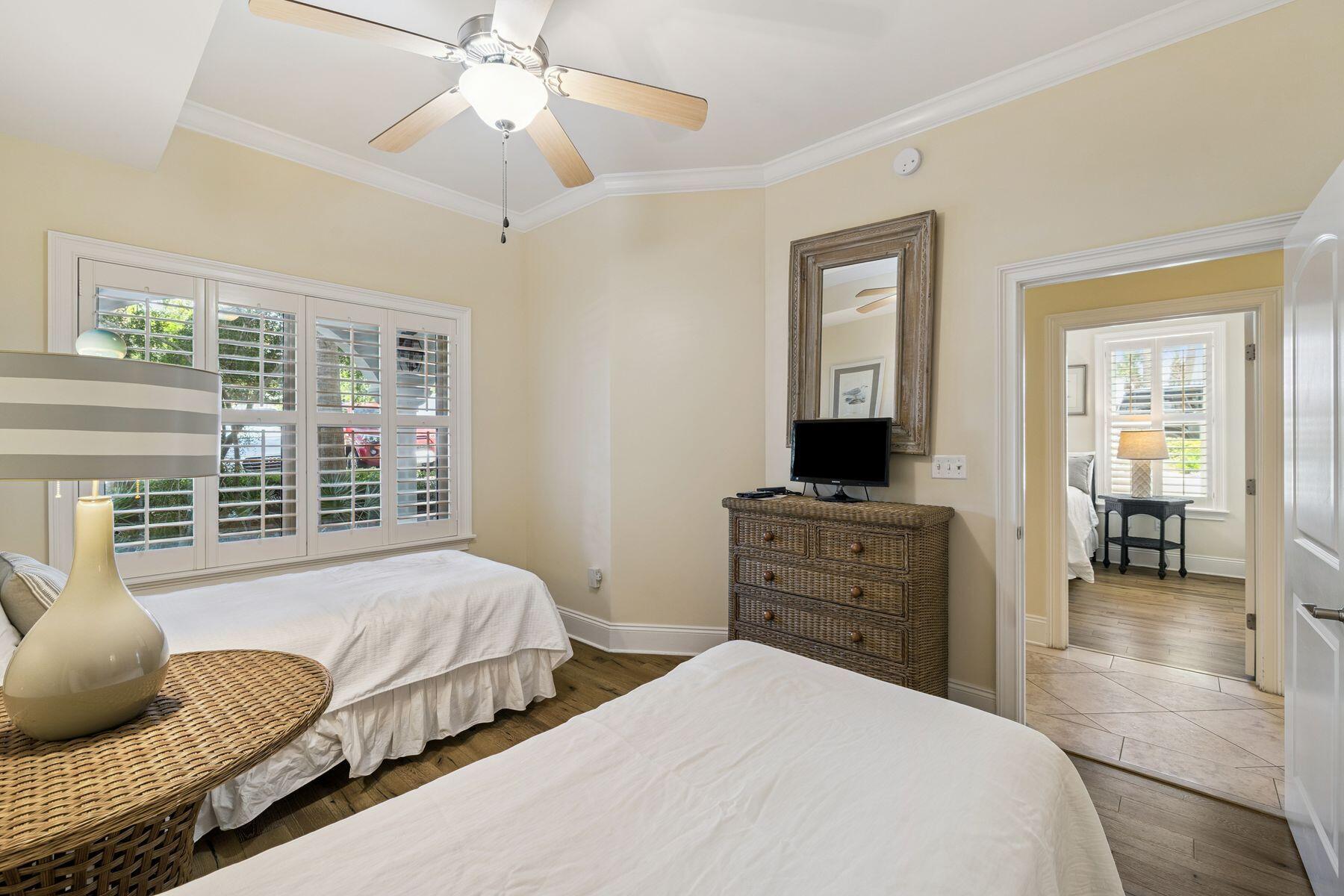 2421 West County Highway 30A, Unit D101 Santa Rosa Beach, FL 32459 - Photo 16 of 44 a bedroom with beds and large windows