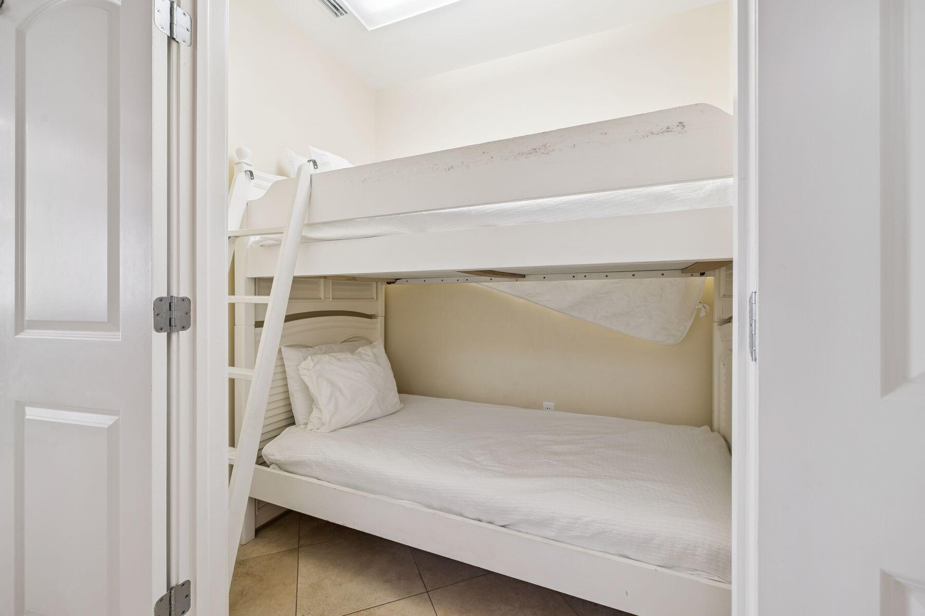 2421 West County Highway 30A, Unit D101 Santa Rosa Beach, FL 32459 - Photo 22 of 44 a bedroom with a bed and a window