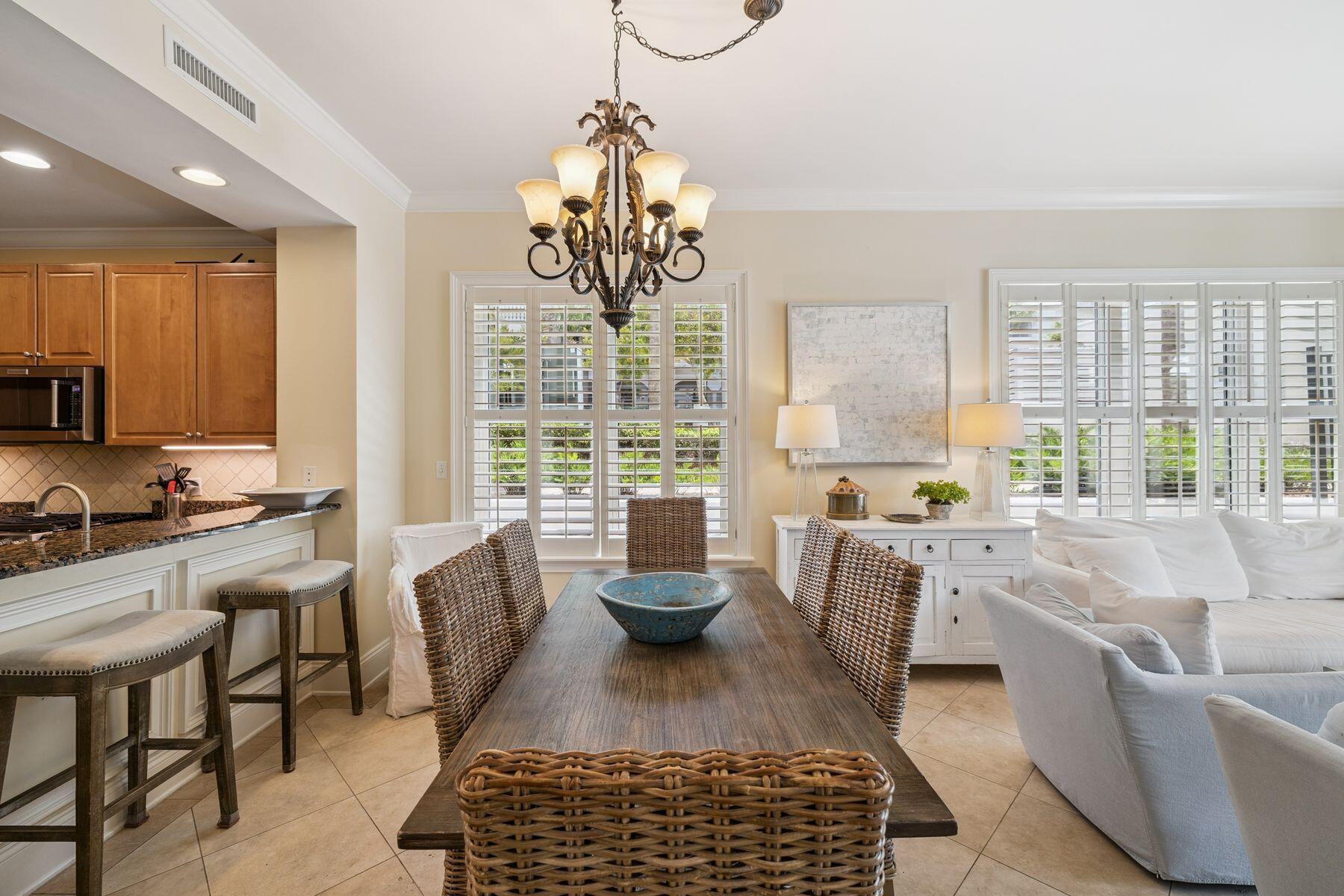 2421 West County Highway 30A, Unit D101 Santa Rosa Beach, FL 32459 - Photo 25 of 44 a living room with furniture floor to ceiling window and a table
