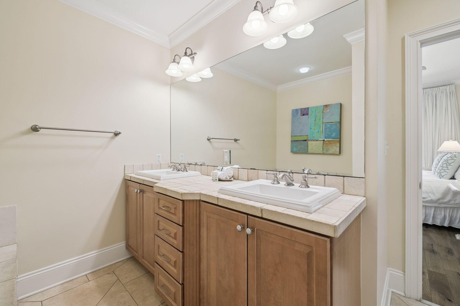 2421 West County Highway 30A, Unit D101 Santa Rosa Beach, FL 32459 - Photo 30 of 44 a bathroom with a sink a vanity and a mirror