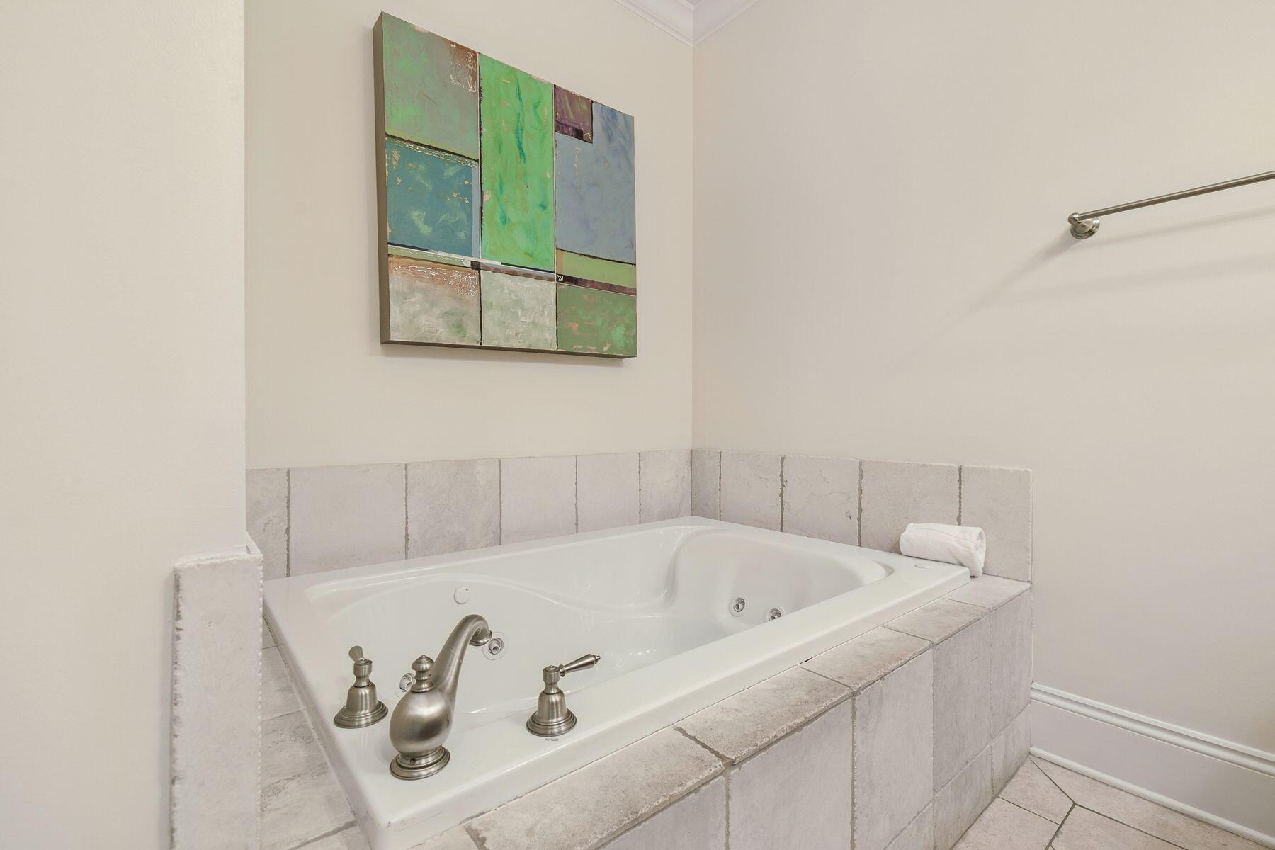 2421 West County Highway 30A, Unit D101 Santa Rosa Beach, FL 32459 - Photo 32 of 44 a bathroom with a bathtub