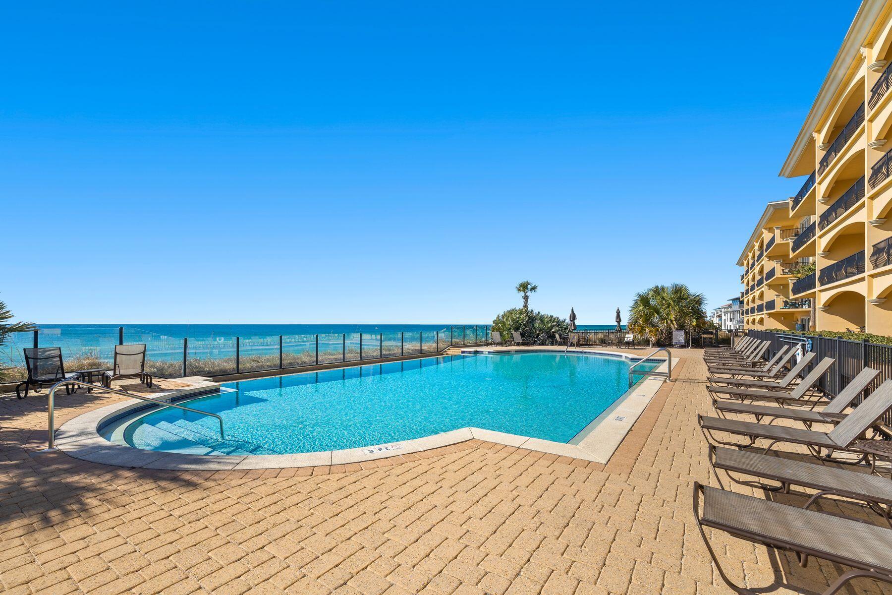 2421 West County Highway 30A, Unit D101 Santa Rosa Beach, FL 32459 - Photo 40 of 44 a view of swimming pool with outdoor seating and plants