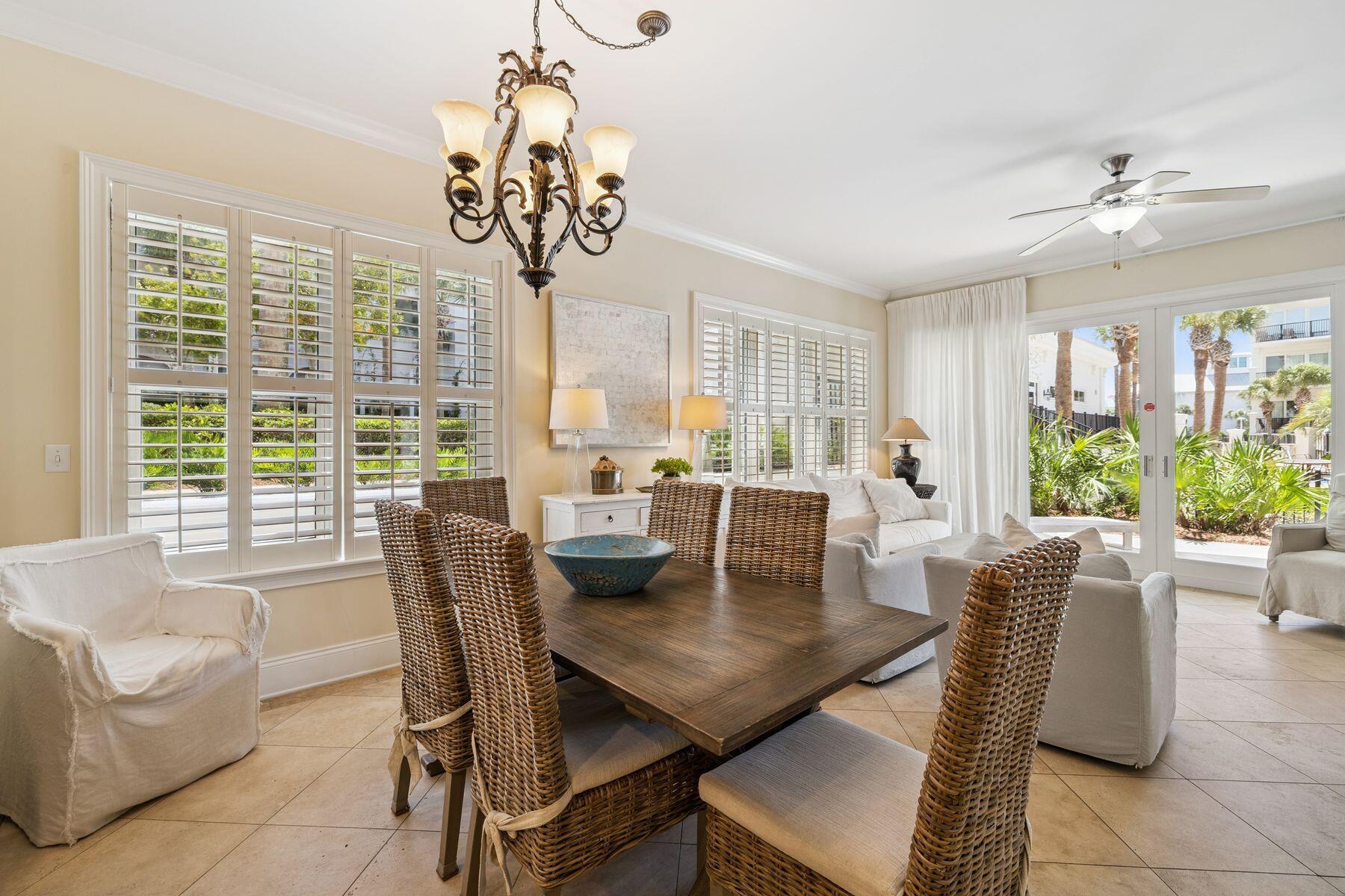 2421 West County Highway 30A, Unit D101 Santa Rosa Beach, FL 32459 - Photo 7 of 44 a view of a dining room with furniture window and outside view