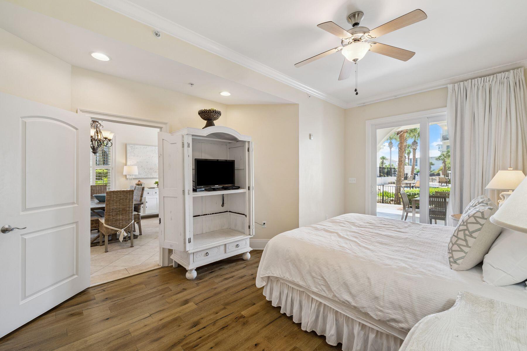 2421 West County Highway 30A, Unit D101 Santa Rosa Beach, FL 32459 - Photo 10 of 44 a bedroom with a bed and a flat screen tv