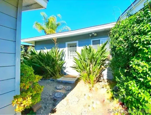 a view of a with plants from a window