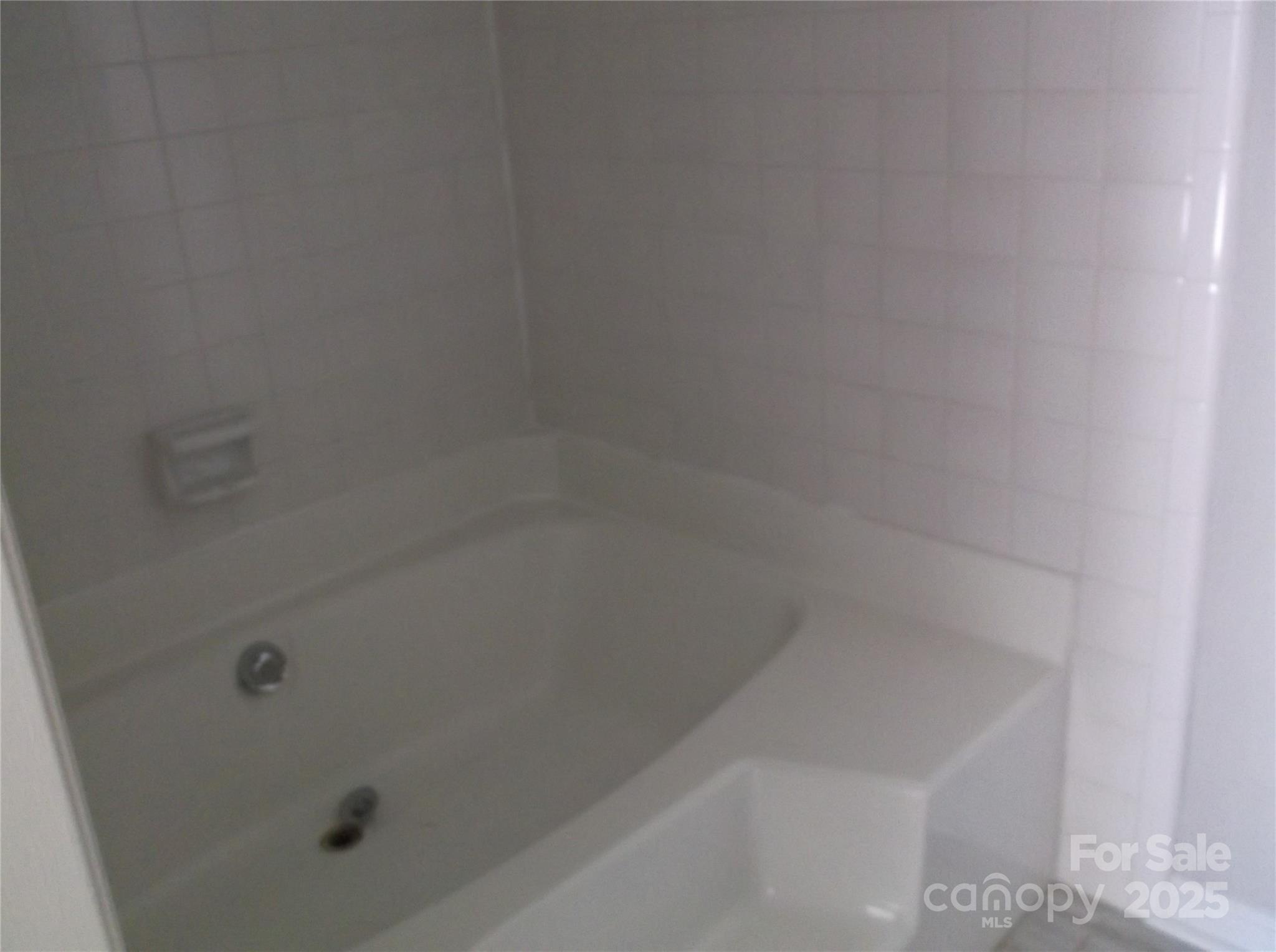 5007 Sharon Road, Unit O Charlotte, NC 28210 - Photo 12 of 20 a close up of a bathtub