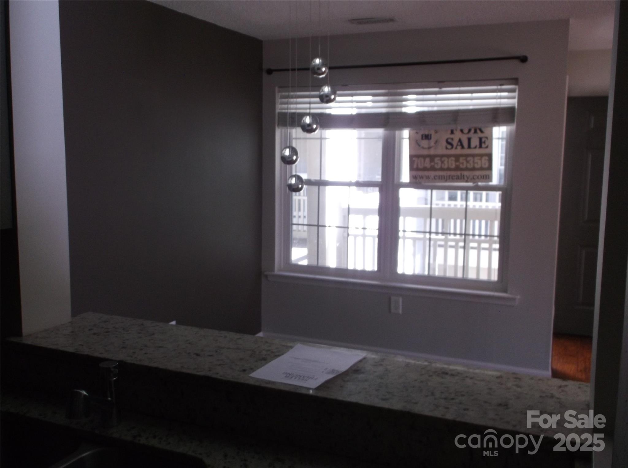 5007 Sharon Road, Unit O Charlotte, NC 28210 - Photo 16 of 20 a view of an empty room with a window