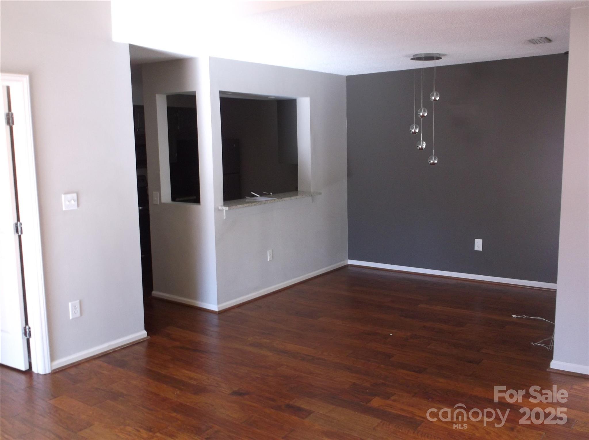 5007 Sharon Road, Unit O Charlotte, NC 28210 - Photo 18 of 20 a view of a hallway with wooden floor